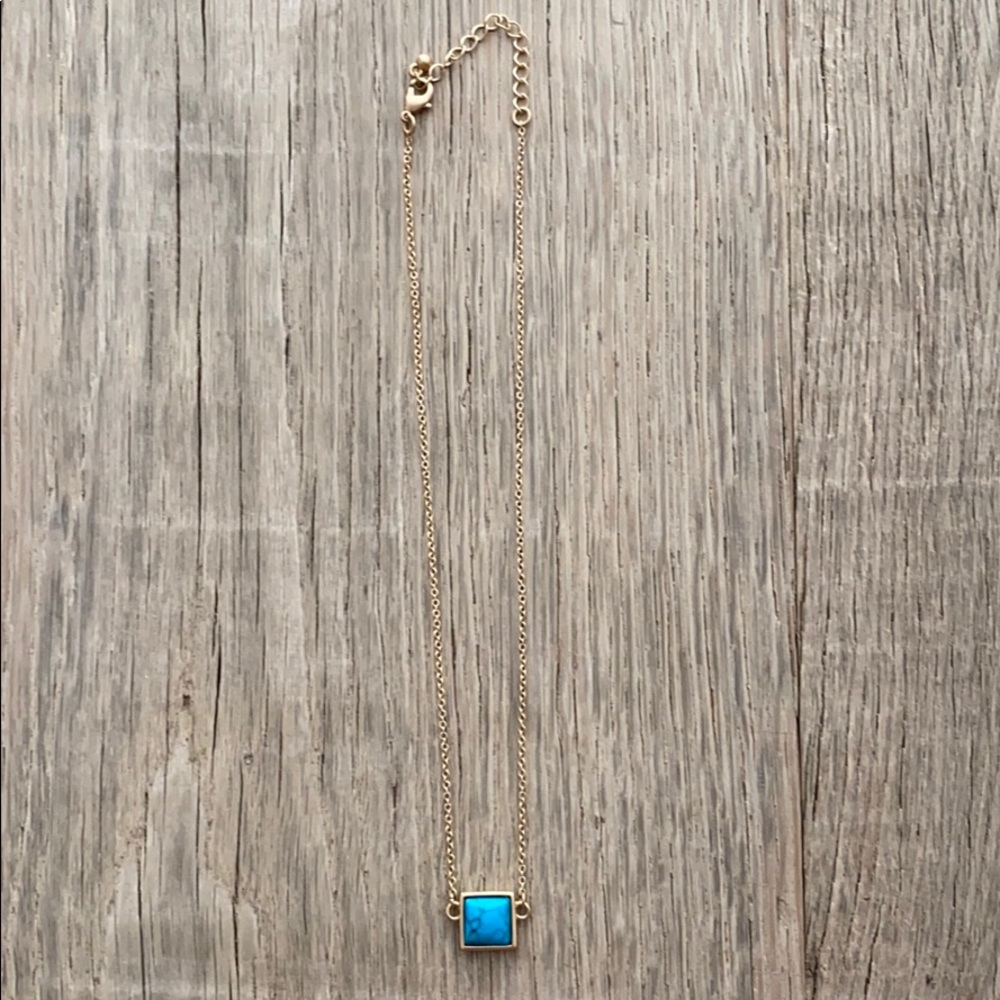 Short gold necklace with turquoise square